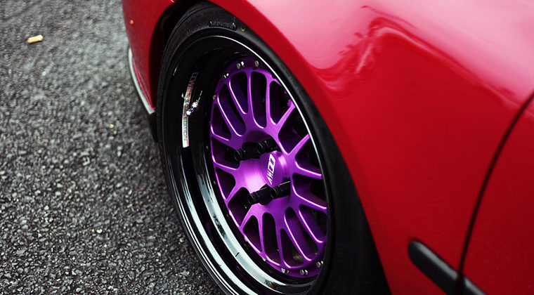 Red Car with Purple Wheels